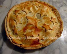 a pie with stars on it sitting on top of a table