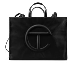 The Iconic Unisex Shopping Bag Is An Everyday Bag For Everyone. - Currently Sold Out On Website. These Are Seasonal Dropped Items, Which Makes This Unique. Featuring A Double Strap (Handles And Cross-Body Straps), Embossed Logo, A Main Compartment With Magnetic Snap Closure, Internal Laptop-Sized Compartment With Zipper Closure In Back And Additional Internal Pocket In Front. Made From Faux Leather And Twill Lining. Bag Is Packaged In A Drawstring Bag With Screen-Printed Logo. Large Fits A Long Telfar Black, Telfar Bags, Body Straps, Cotton Drawstring Bags, Bags Aesthetic, Logo A, Survival Kit, Everyday Bag, Black Bag