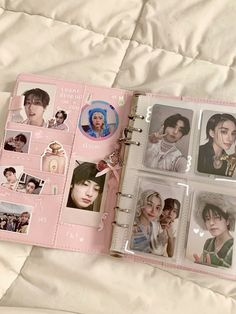 an open pink book with pictures of people on the pages and in between them is a white bed sheet