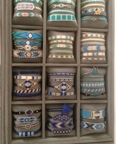 a gray box filled with lots of different types of bracelets