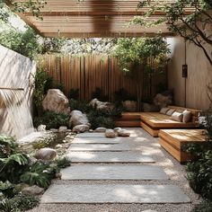 an outdoor patio with stone steps and benches