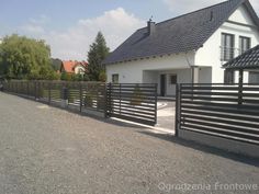 a house with a black fence in front of it