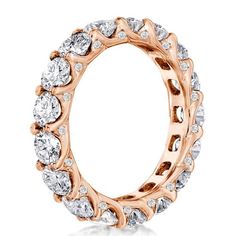 a rose gold ring with white diamonds