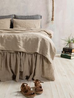 a pair of shoes sitting on the floor next to a bed