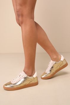 Metallic Sneakers With Perforations And Round Toe, Metallic Sneakers With Perforations, Metallic Leather Lace-up Sneakers, Gold Leather Low-top Sneakers, Gold Leather Sneakers With Gum Sole, Metallic Sneakers With Perforated Toe Box, Casual Metallic Sneakers With Perforated Toe Box, Trendy Leather Sneakers With Flat Heel, Gold Leather Sneakers With Rubber Sole