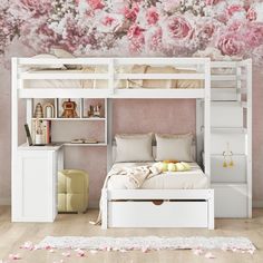 a white bunk bed with pink flowers on the wall