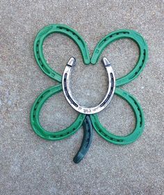 a horseshoe shaped like a four leaf clover