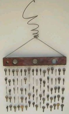 a bunch of keys hanging on a wall