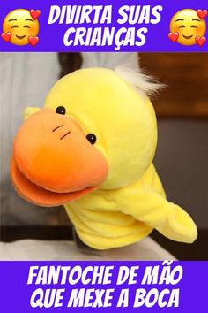 a yellow stuffed animal sitting on top of a table