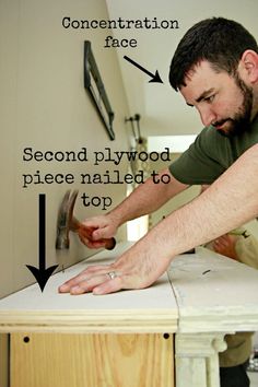 a man working on a piece of furniture with the words, second plywood piece nailed to top