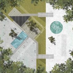 an aerial view of a swimming pool surrounded by trees and grass, with two benches on the other side