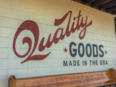 there is a sign on the wall that says quality goods made in the usa,