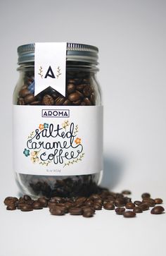 a jar filled with coffee beans sitting on top of a table