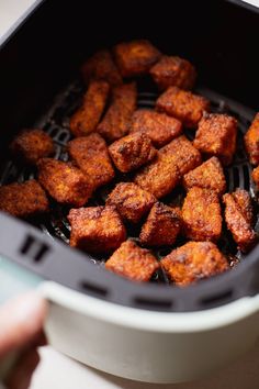 the food is being cooked in the air fryer