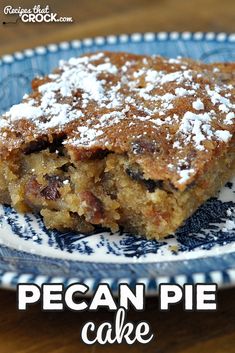 a piece of pecan pie on a blue and white plate with the words pecan pie cake