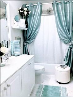 a bathroom with blue and white decor in it