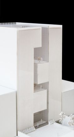 a model of a house with white walls and floors