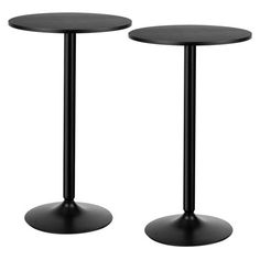 two black round tables sitting next to each other