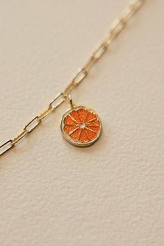 Gold filled enamel orange slice charm is sweet and summery. Add some joy to your charm necklace with this bright and summery slice. Hand make your custom charm necklace in Laguna Beach or build your piece online through adding a base necklace and your selection of charms. Leave us a note on your order for any special requests. gold filled Tarnish resistant Enamel Orange Pendant Charm Necklaces For Gifts, Orange Charm Jewelry For Gifts, Tiny Charms, Charm Bar, Custom Charm Necklaces, Orange Slice, Orange Necklace, Tiny Charm, Nice Outfits