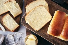 sliced bread and butter on wooden cutting boards