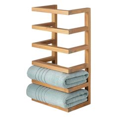 a wooden towel rack with three folded towels on it and one folded in the middle