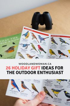 a person holding an open book with birds on it and the words woodland woman ca holiday gift ideas for the outdoor enthusiast