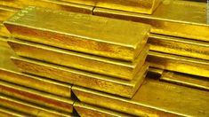 stacks of gold bars stacked on top of each other