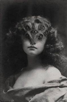 an old black and white photo of a woman with weird eyes