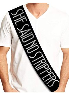 a man wearing a white shirt and black sash with the words she saunder girl on it