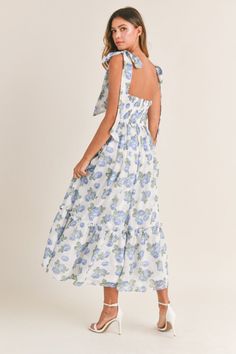 Elegant, trendy, and chic, our Florence Blue Floral Tie Strap Midi Dress is perfect for wedding guests, special events, showers, and vacations abroad. Featuring a ruched bodice, tie straps, tiered skirt, padded inserts, a smocked back, back zipper closure, and a blue floral print pattern throughout. Lined. 100% Polyester. True to size. Model measurements: Height 5'5", Bust 33", Waist 25", Hips 33" wearing a size Small. Cindy Dress, Bedroom Girl, Flower Maxi Dress, Floral Bustier, Blue Florals, Bra Cup, Tiered Midi Dress, Flowing Skirt, Dresses By Length