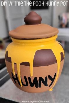 a pot that has been painted with the word humpy on it and is sitting on top of a table