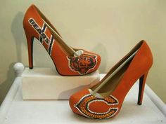 an orange high heeled shoe with a chicago bears design on it