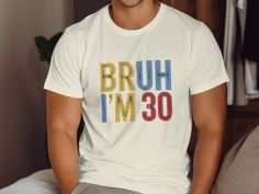 Celebrate your milestone birthday in style with this Funny Bruh I'm 30 T-Shirt. Perfect for a 30th birthday bash, this shirt features a retro design and a humorous message sure to make everyone smile. Makes a great gift for anyone turning 30. Soft, comfortable, and available in multiple sizes. Product Features: Fabrication: 100% ring-spun cotton - Light fabric (4.5 oz/yd² (153 g/m Seams: Without side seams Fit: Eurofit Sizing: Runs true to size Label: Tear-away label 💖 Why Choose us? At Bibi Cu 30th Birthday Bash, 30th Birthday Shirts, Style Birthday, Old Shirts, Birthday Tee, 30 Years Old, Birthday Shirt, 30th Birthday, Cotton Lights