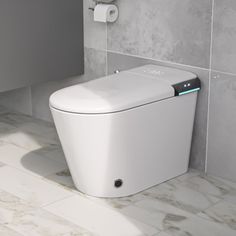 a white toilet sitting in a bathroom next to a wall mounted paper dispenser