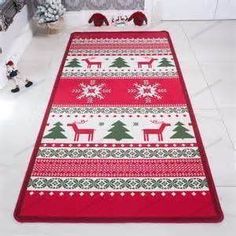 a red and green christmas rug on the floor