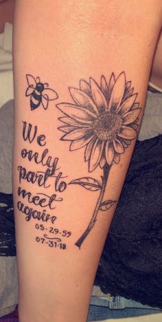 a woman's arm with a sunflower and bible verse tattooed on the side