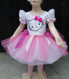 a mannequin wearing a pink and white hello kitty tutu