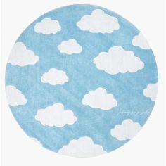 a blue and white rug with clouds on it