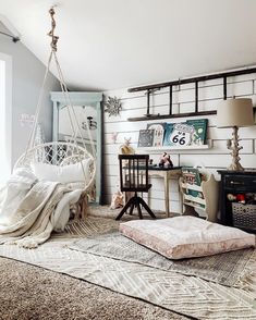 a living room with a hammock chair and other furniture