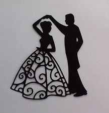 a cutout of a man and woman dancing in front of a white background with the silhouettes of two people