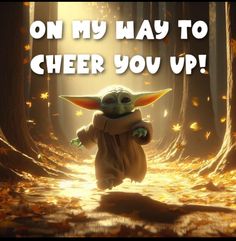 a baby yoda walking in the woods with leaves around it and text that reads, on my way to cheer you up