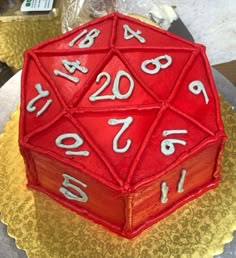 a red cake with white numbers on it