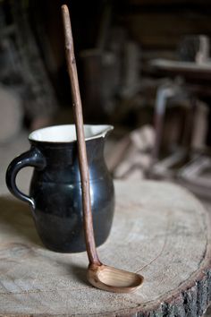 a wooden stick sticking out of a black cup