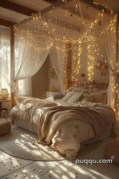 a bedroom decorated in white and gold with fairy lights on the ceiling, bedding and curtains