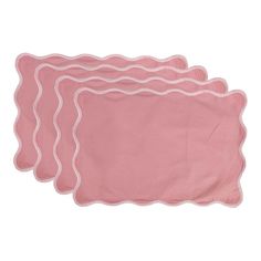 three pink place mats with scalloped edges