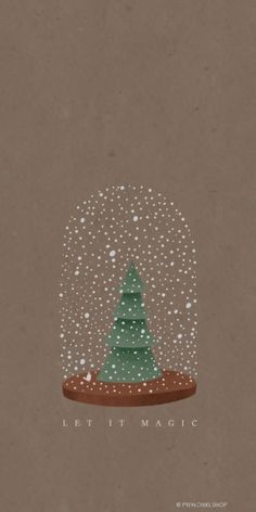 a snow globe with a christmas tree in it and the words let it magic written below