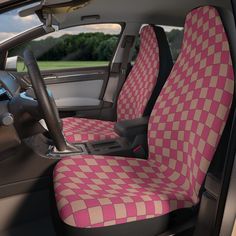 an orange and pink checkered seat covers in a car