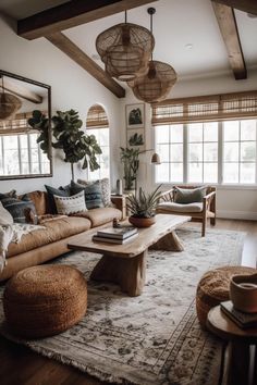 a living room filled with lots of furniture and plants on top of a wooden table