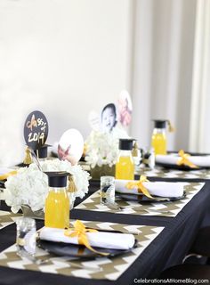 the table is set with black and white decor