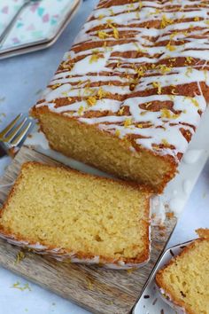 a loaf of lemon pound cake sitting on top of a cutting board